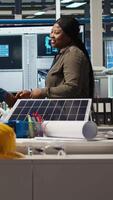 Vertical Investors shaking hands, meeting to talk about automation strategies for solar panel production scaling. Shareholders doing greeting handshake in photovoltaics factory, camera A video