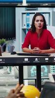 Vertical Managers in office reviewing solar technology reports during internet videocall. Shareholders in remote teleconference meeting discussing investment opportunities in green energy production, camera B video
