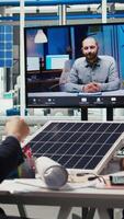 Vertical Experts optimize factory equipment energy output during remote teleconference call. Photovoltaics plant researchers doing internet videocall meeting, evaluating energy production, camera A video