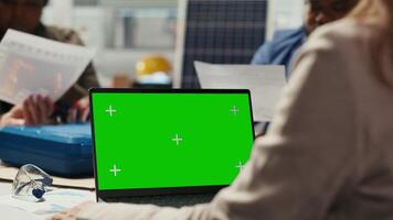 Industrial plant researchers work on breakthroughs in durability and performance using mockup notebook. Factory scientists use green screen laptop to test materials for next generation solar panels video