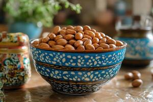 A bowl of nuts sitting on a table photo