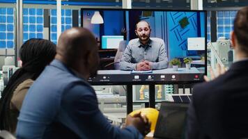 Experts optimize factory equipment energy output during remote teleconference call. Photovoltaics plant researchers doing internet videocall meeting, evaluating energy production, camera B video