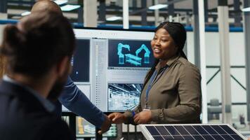 Investors shaking hands, meeting to talk about automation strategies for solar panel production scaling. Shareholders doing greeting handshake in photovoltaics factory, camera B video