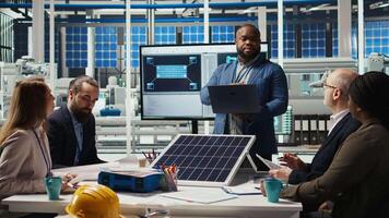 Portrait of smiling photovoltaics factory scientists experimenting with advanced PV materials to improve solar panel durability. Researchers developing efficient sustainable energy solutions, camera A video
