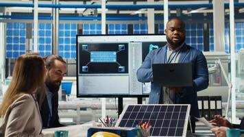 Portrait of smiling photovoltaics factory scientists experimenting with advanced PV materials to improve solar panel durability. Researchers developing efficient sustainable energy solutions, camera B video