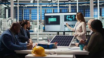 Scientists conduct experiments on PV materials to improve solar panel efficiency. Photovoltaics factory research and development department experts working on renewable energy solutions, camera A video