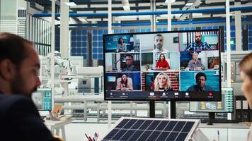 Photovoltaics plant shareholders analyze market trends during online videocall to determine investment strategy. Managers in teleconference meeting look at data, expanding factory production, camera A video