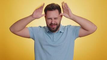 Comical funny caucasian man making playful silly facial expressions, fooling around, showing tongue video
