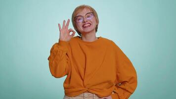 Woman looking approvingly, showing ok approve feedback gesture like sign positive something good video