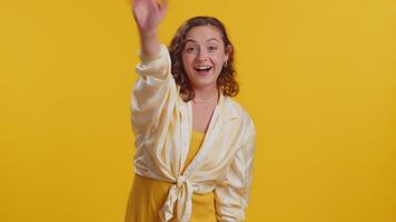 Smiling woman waves hand palm in greeting gesture welcomes someone, hello, welcome, join us, welcome video