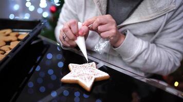 Chef draws patterns on cookies with a pastry bag video