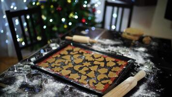 Raw gingerbread lies on a baking sheet on the table video