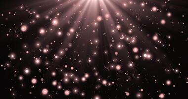Pink Gold luxury bokeh on particles floating in the air. Dust and glitter particles background. Black background , Use blending mode screen. Loop Animation video