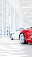 Luxury cars displayed in a contemporary dealership with bright lighting and spacious layout photo