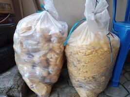 Stale bread that has expired in a plastic bag. Usually used for fish feed photo