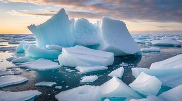 Ice formations breaking apart in the ocean under a serene sky at twilight photo