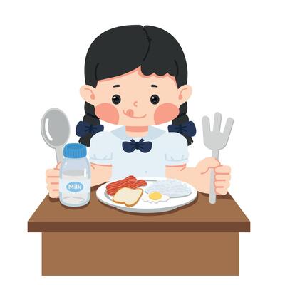 Kid girl student is sitting at the table eating a meal