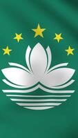 Vertical, portrait waving national flag of Macau. Smooth animation with highly detailed, realistic animated background for social media, screens smartphone. Cloth motion, official colors. video
