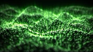 Glittering waves background with green glow particles on a dark background and radioactive shine effect. Bright substance animation for science fiction, modern technology and abstract art. 4K 60fps video