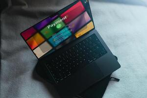 Top view of open laptop with banking interface on screen for payment. Shopping online concept. Financial transfer. photo