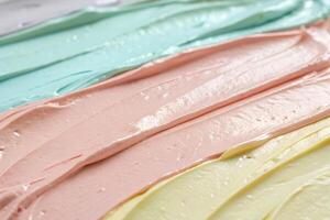 Close Up of Smooth Creamy Paint Strokes in Pastel Colors with Glossy Finish photo