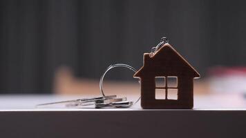 House keychain with keys symbolizing new home purchase video
