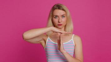 Tired upset woman showing pause gesture, limit or stop sign, time out, take a break relax, rest video