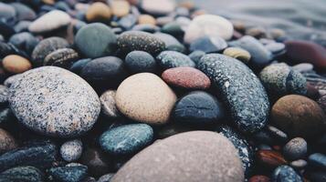 Close Up of Wet Smooth and Speckled Stones in Muted Tones photo