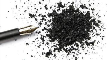Black Ink Splatter Near Fountain Pen on White Background photo