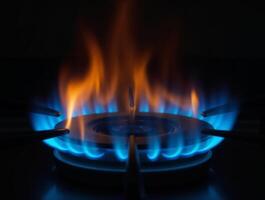 Bright blue flames erupting from a gas burner photo