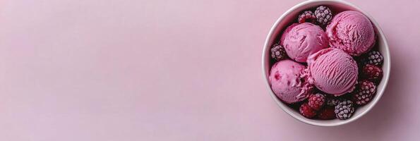 A bowl of ice cream with berries and raspberries photo