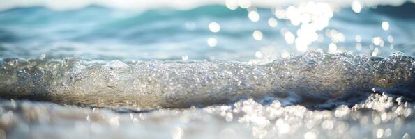 A wave is seen in the ocean with sunlight shining on it photo