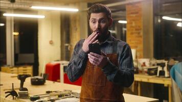Amazed Caucasian wood master repairman man guy male scroll mobile phone surprise online shocked handyman saying workman wow emotion in workshop builder worker winning carpenter celebrating excitement video