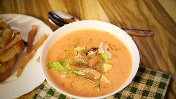 Dietary fish soup-puree with salmon on a light background video