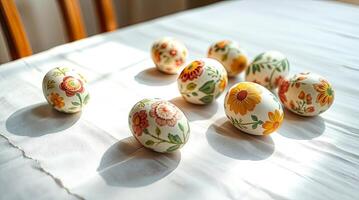 Colorful Easter eggs close up on a white tablecloth. photo