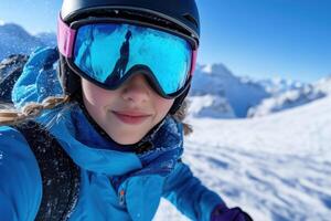 Portrait of a girl in helmet and goggles on a background of mountains photo