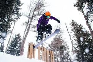 Snowboarder executes thrilling backflip photo