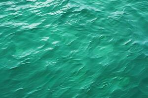 top view abstract background green water surface with light ripples photo