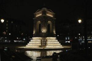 Illuminated Fountain and Monument in Paris, France 20.01.2025 at Night photo