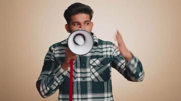 Man talking with megaphone, proclaiming news, loudly announcing advertisement pointing empty place video