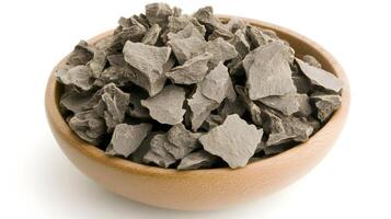 Raw cacao nibs, a rich earthy treasure in a rustic wooden bowl, promising a journey to pure chocolate bliss. photo