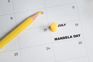 July 18. writing text mandela day on calendar date. Save the date. Important date. Holiday day of the year concept photo