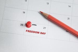 April 27. writing text Freedom day on calendar date. Save the date. Important date. Holiday day of the year concept photo