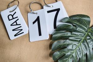 Save the date white block calendar for St Patrick's day. March 17 on the table photo