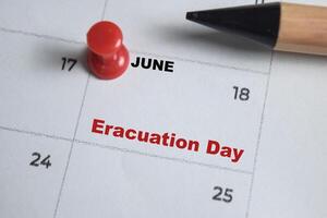 June 18. writing text Eracuation Day on calendar date. Save the date. Important date. Holiday day of the year concept photo