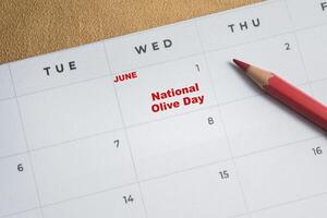 June 1. writing text National Olive Day on calendar date. Save the date. Day of the year concept. photo