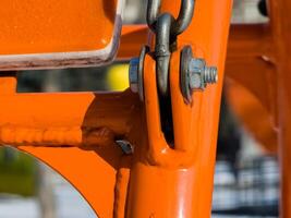 Close up of bolt fastener with washers and nuts with chain. photo