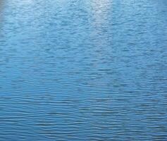 Water, ripple and nature with environment river with waves, calm and closeup. Natural background. photo