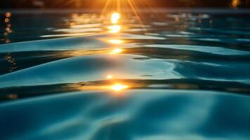 Glowing sunset reflections over calm water with gentle waves creating a serene atmosphere video