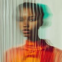 a woman with a colorful dress and a blurred background photo